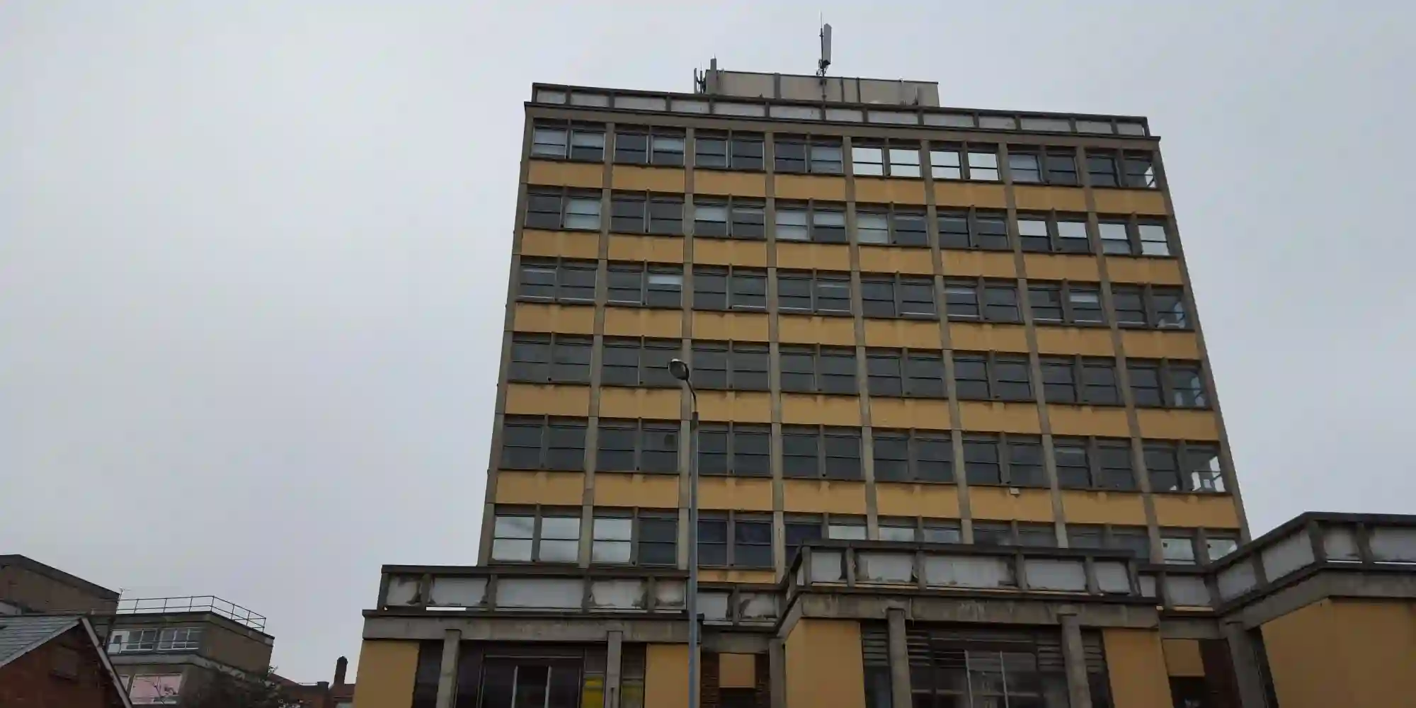 masonry building with brick facade, wooden floors and timber roof structure